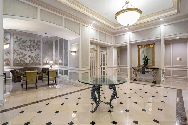 a view of kitchen with stainless steel appliances refrigerator oven and cabinets