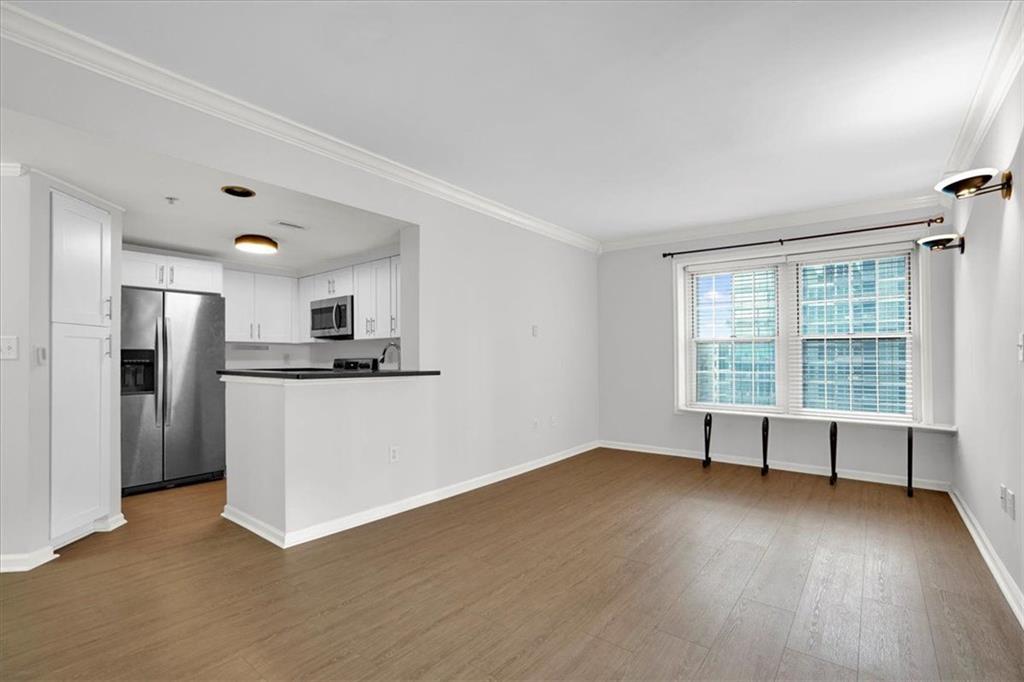 199 14th Street Northeast, Unit 2308 Atlanta, GA 30309 - Photo 6 of 35 a view of kitchen with stainless steel appliances refrigerator oven and cabinets