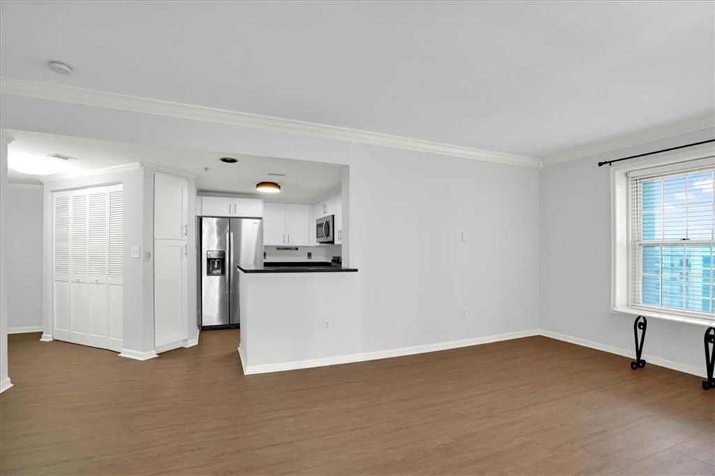 199 14th Street Northeast, Unit 2308 Atlanta, GA 30309 - Photo 7 of 35 a view of a kitchen with a sink and a window