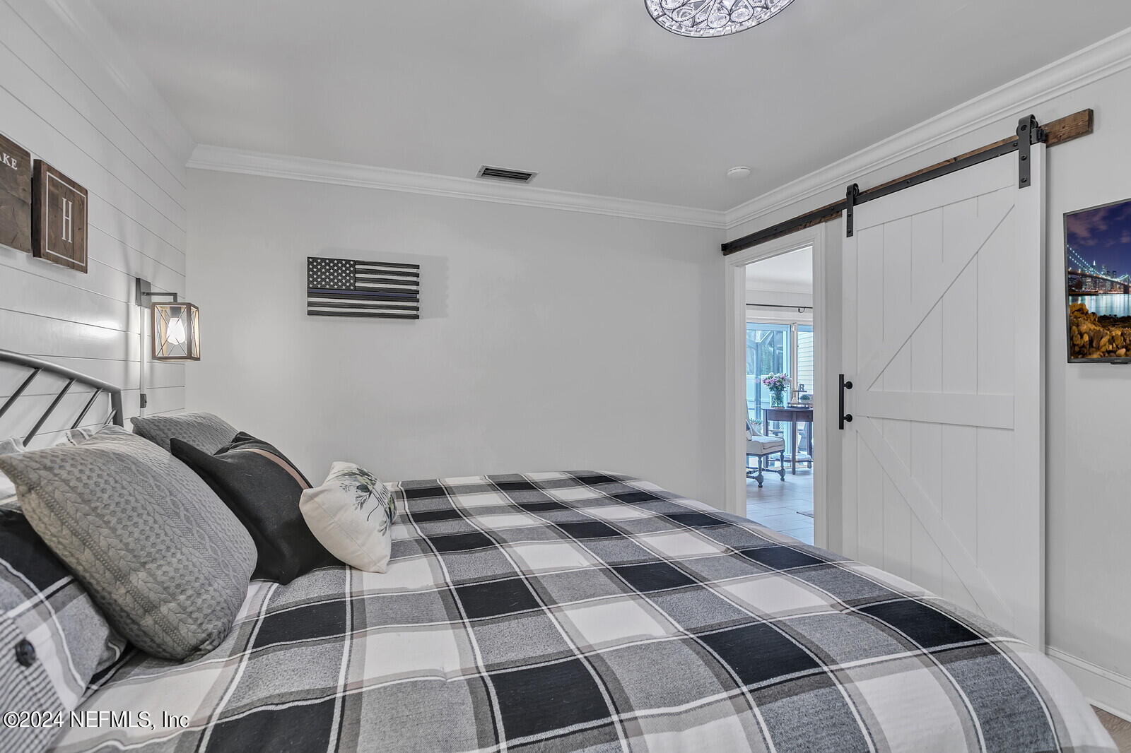 6695 Highway 16 St. Augustine, FL 32092 - Photo 15 of 46 a bedroom with a bed and a window