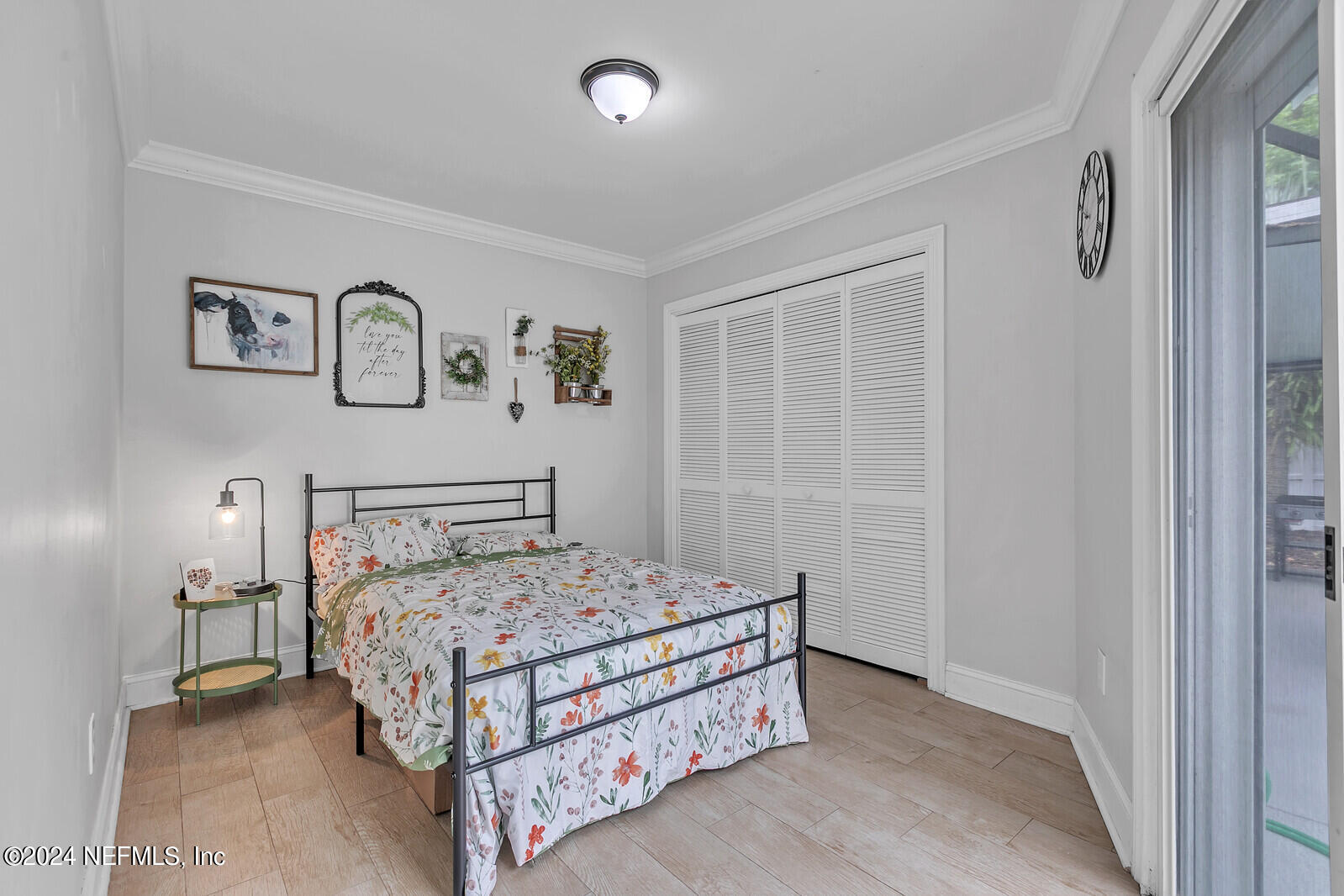 6695 Highway 16 St. Augustine, FL 32092 - Photo 17 of 46 a bedroom with a bed and painting on the wall