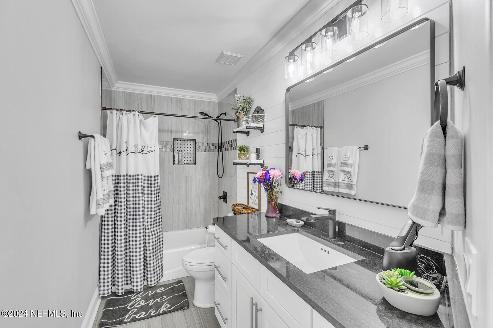 6695 Highway 16 St. Augustine, FL 32092 - Photo 20 of 46 a bathroom with a sink double vanity and a shower