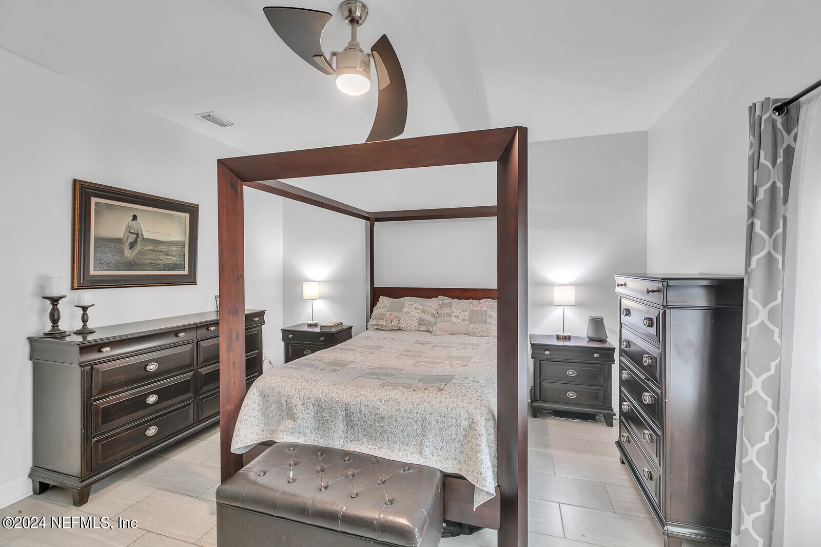 6695 Highway 16 St. Augustine, FL 32092 - Photo 21 of 46 a bedroom with a bed and a mirror on dresser