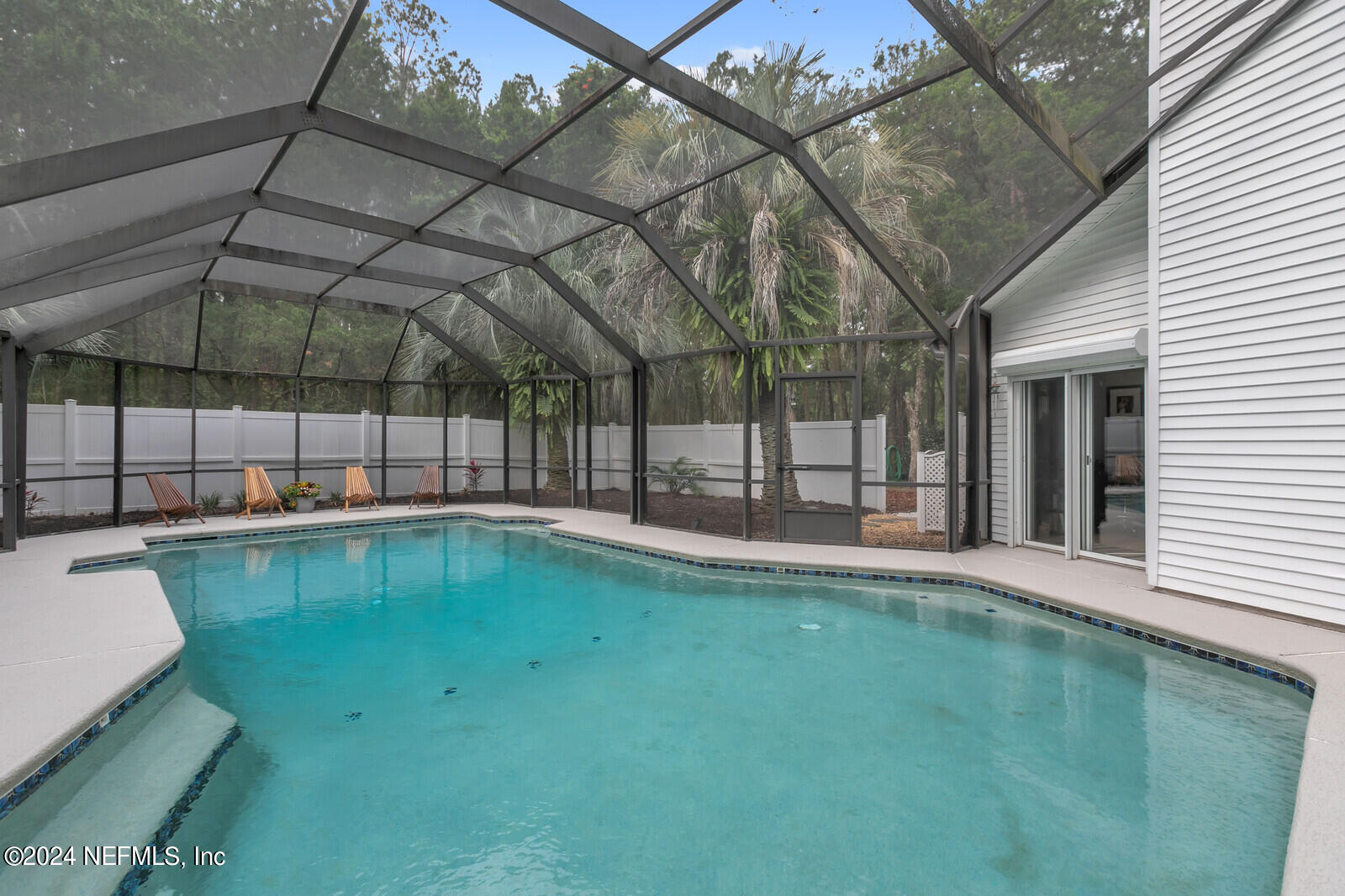 6695 Highway 16 St. Augustine, FL 32092 - Photo 22 of 46 a view of a backyard with a tub and wooden fence
