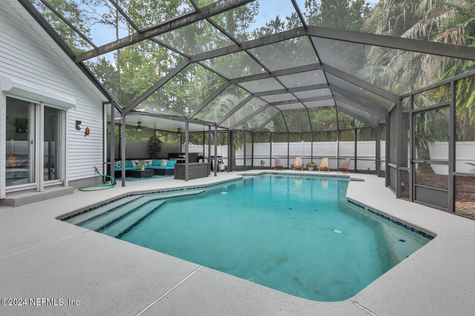 6695 Highway 16 St. Augustine, FL 32092 - Photo 23 of 46 a view of a swimming pool with a patio