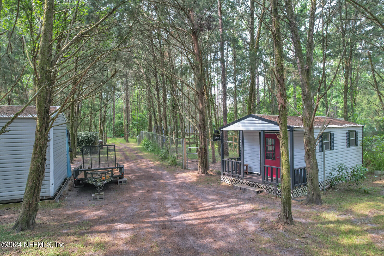 6695 Highway 16 St. Augustine, FL 32092 - Photo 31 of 46 a view of a patio with furniture and a tree