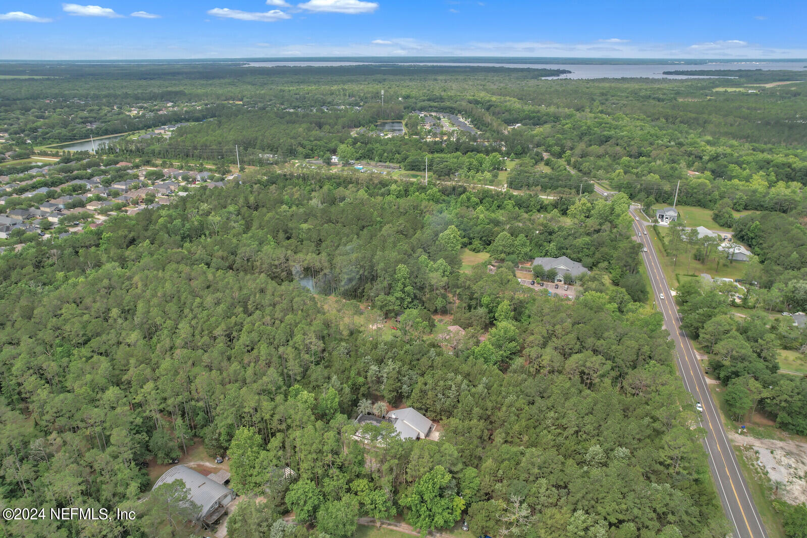 6695 Highway 16 St. Augustine, FL 32092 - Photo 38 of 46 a view of a city with lush green forest