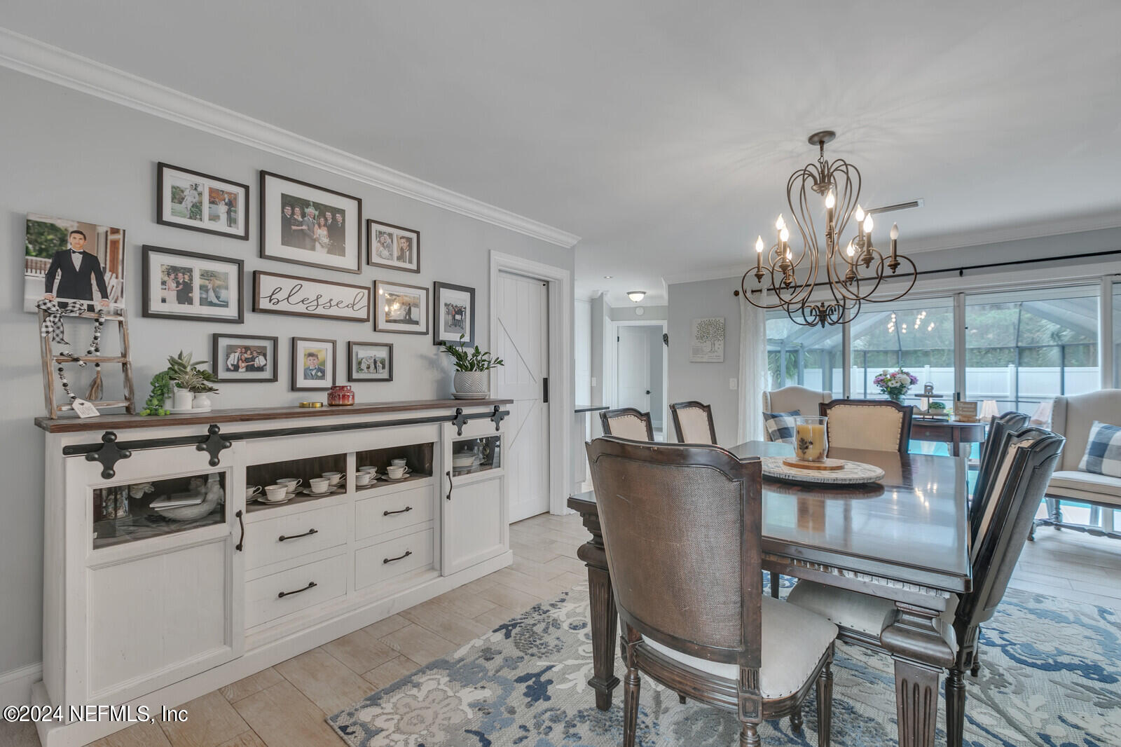 6695 Highway 16 St. Augustine, FL 32092 - Photo 4 of 46 a view of a dining room with furniture and chandelier