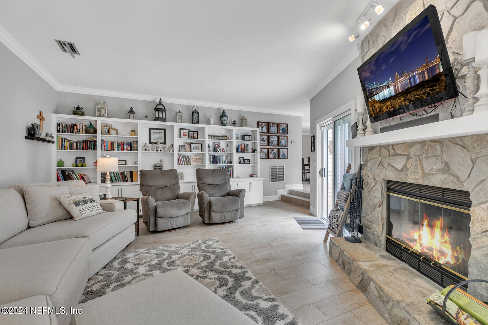 6695 Highway 16 St. Augustine, FL 32092 - Photo 8 of 46 a living room with furniture and a fireplace