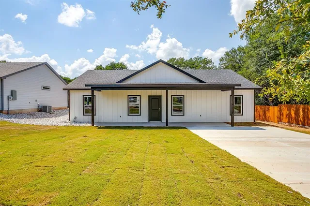 a front view of a house with swimming pool