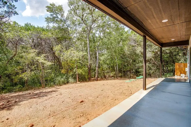 a view of a backyard of the house