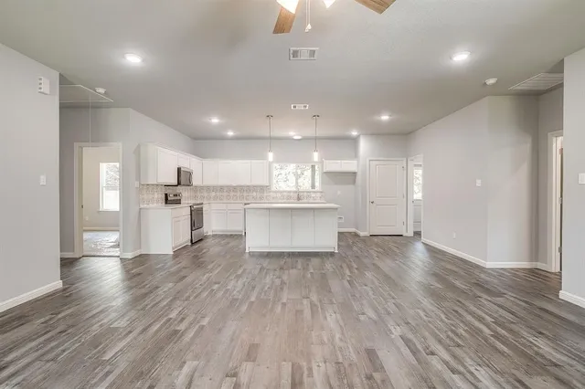a view of kitchen with wooden floor