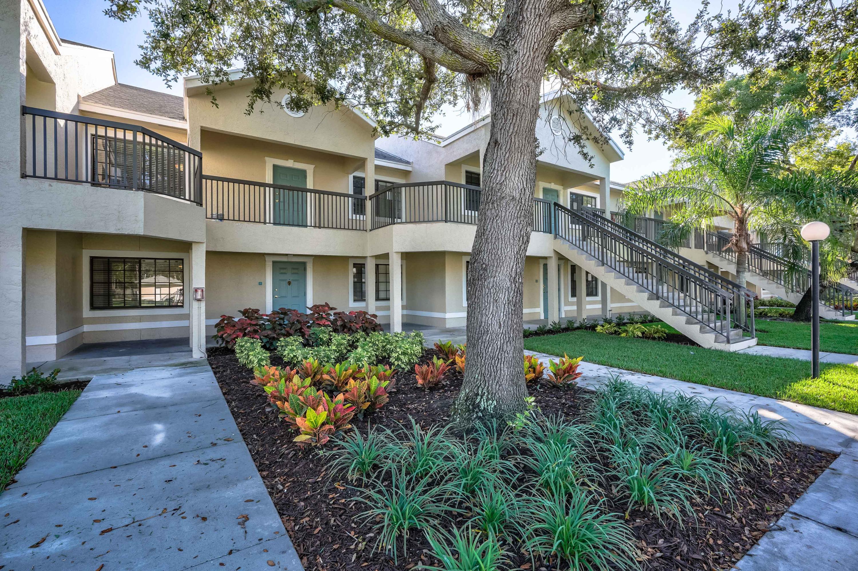 4685 Haverhill Road, Unit F4 West Palm Beach, FL 33417 - Photo 23 of 34 front view of a house with a yard