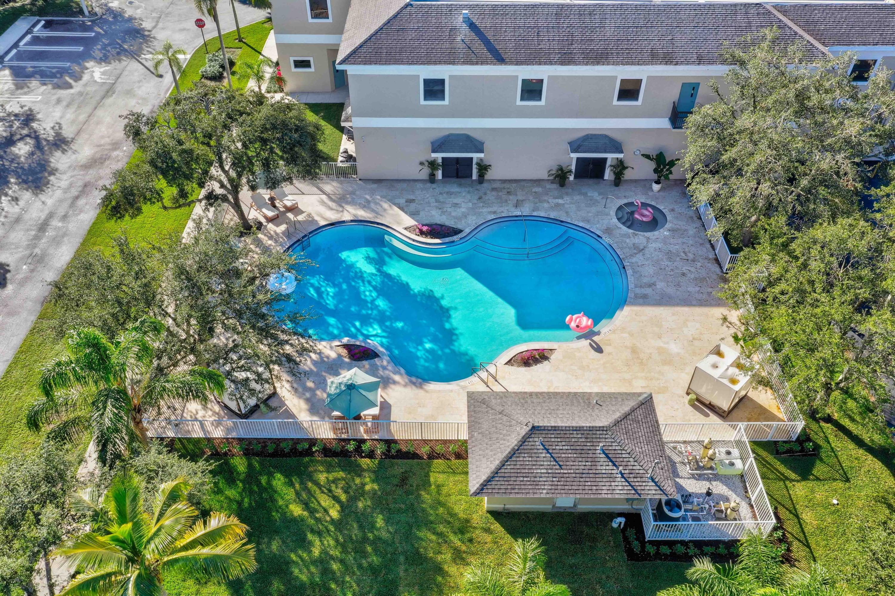 4685 Haverhill Road, Unit F4 West Palm Beach, FL 33417 - Photo 31 of 34 an aerial view of a house with garden space and street view