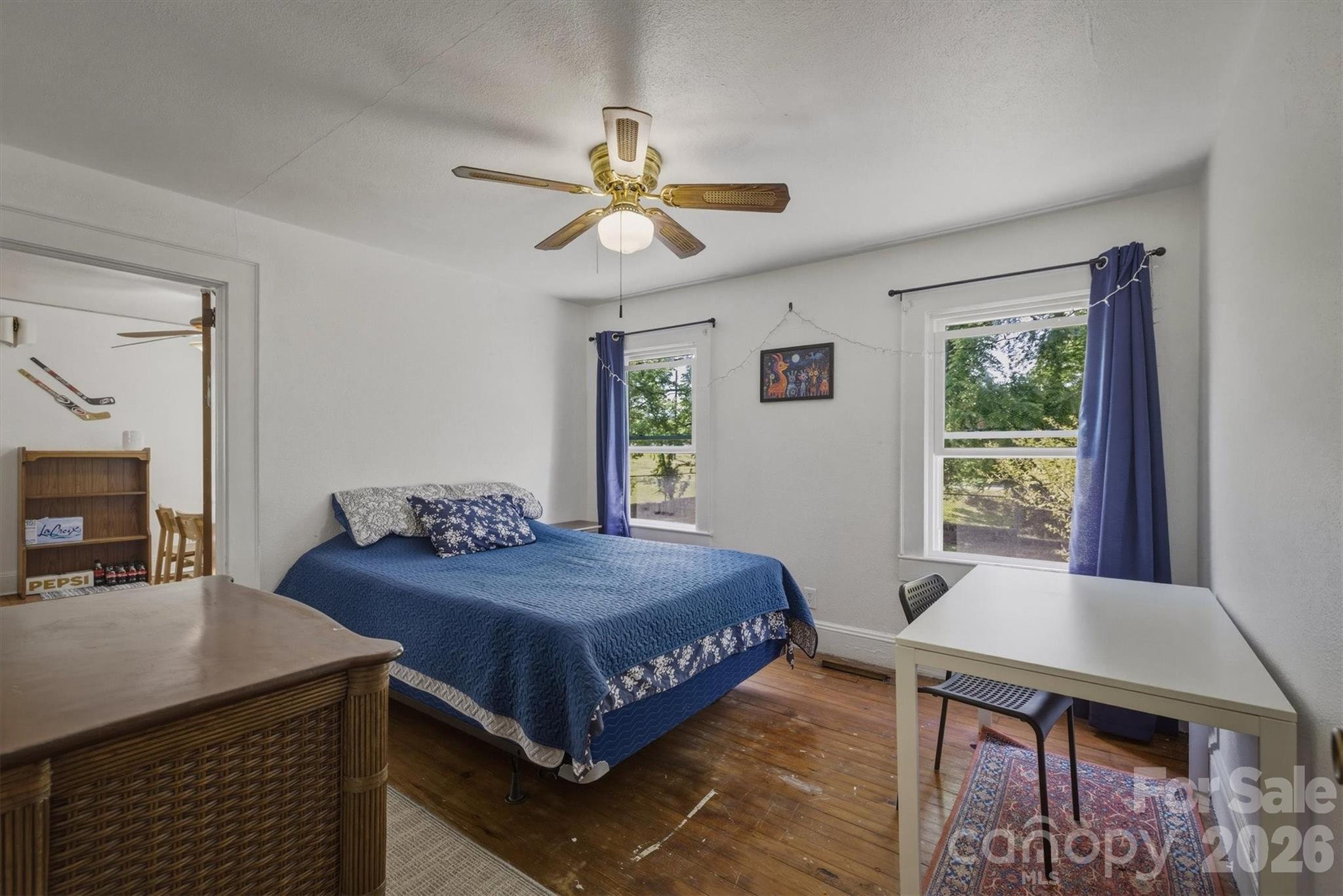 117 3rd Avenue Southwest Hickory, NC 28602 - Photo 16 of 21 a bedroom with a bed and a table in it