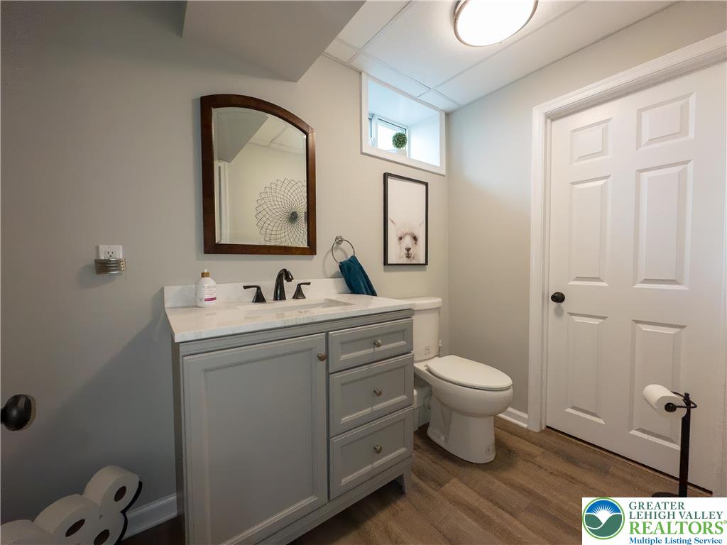 1286 Keller Road Wind Gap, PA 18091 - Photo 37 of 59 a bathroom with a toilet sink and mirror