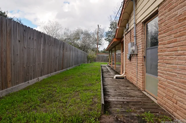 a backyard of a house with lots of green space