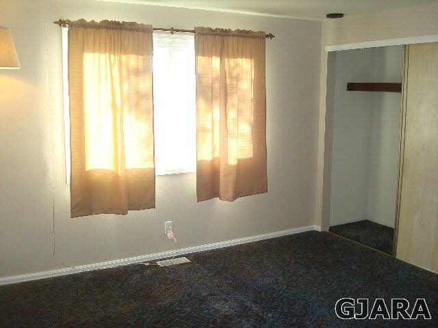 842 21 Road Fruita, CO 81521 - Photo 10 of 35 a view of an empty room with a window