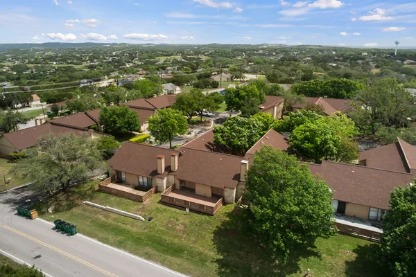 an aerial view of a house with yard swimming pool and outdoor seating