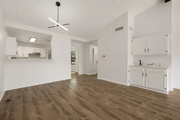 a view of a kitchen with marble kitchen and kitchen sink