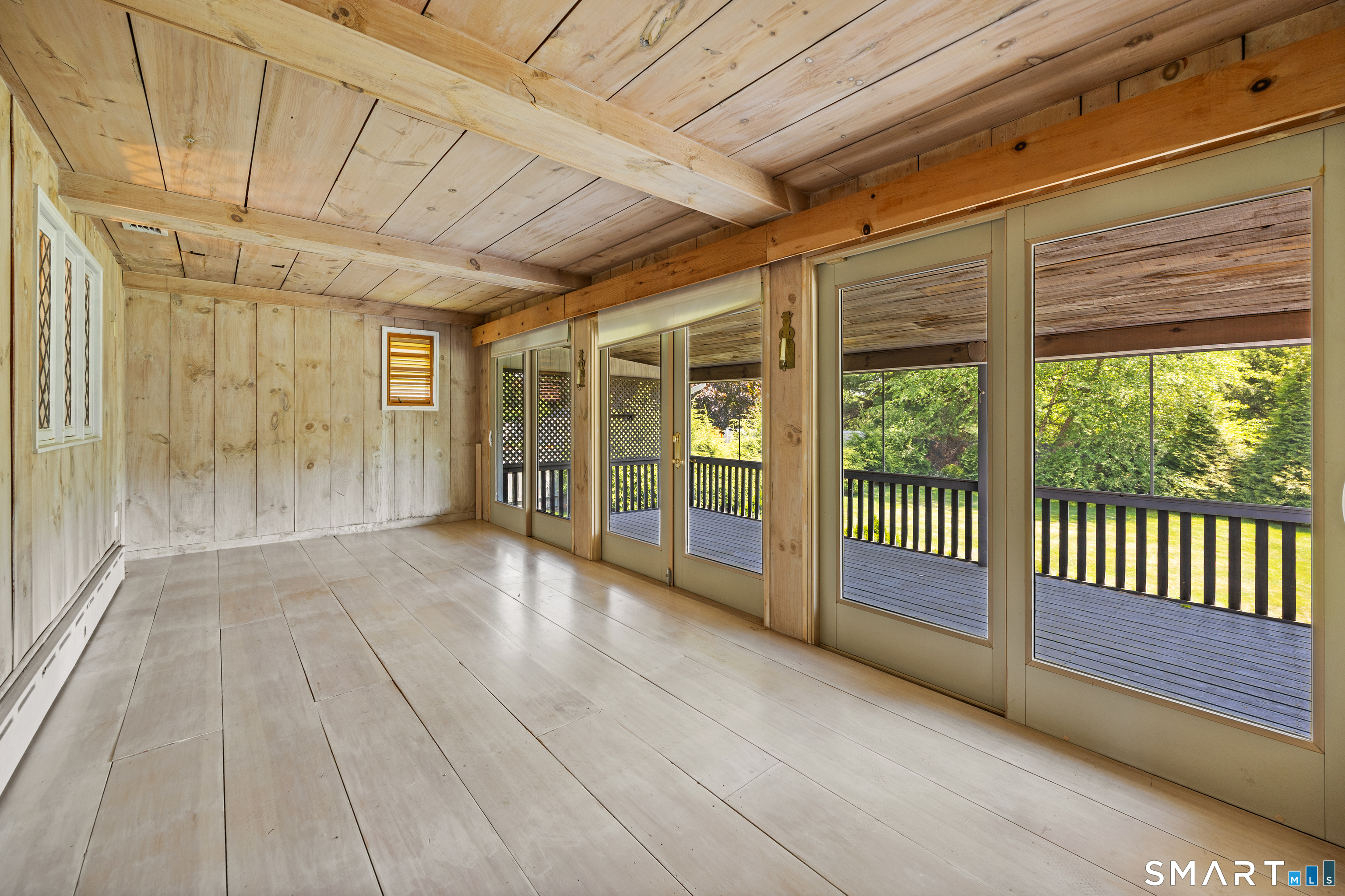 52 Susan Lane Meriden, CT 06450 - Photo 13 of 28 a view of a porch with wooden floor and iron stairs