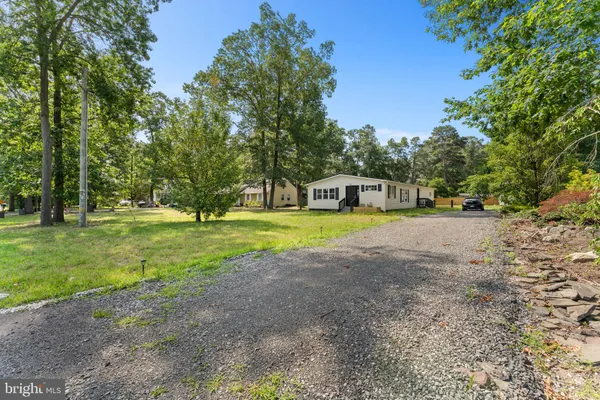 a view of a house with a big yard