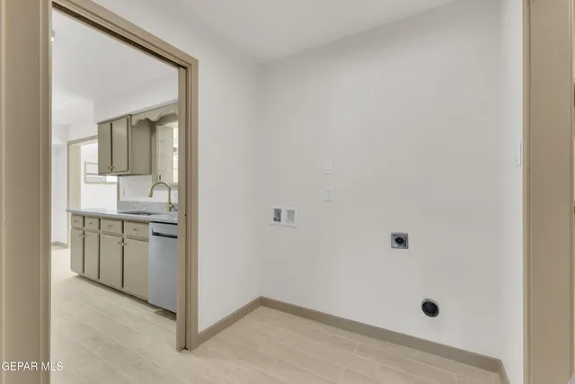 a bathroom with a granite countertop sink mirror and vanity