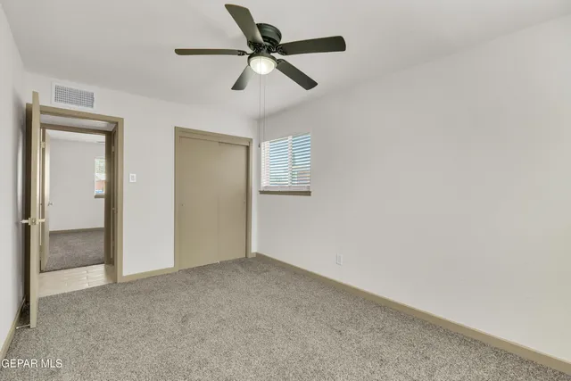 a view of room with ceiling fan