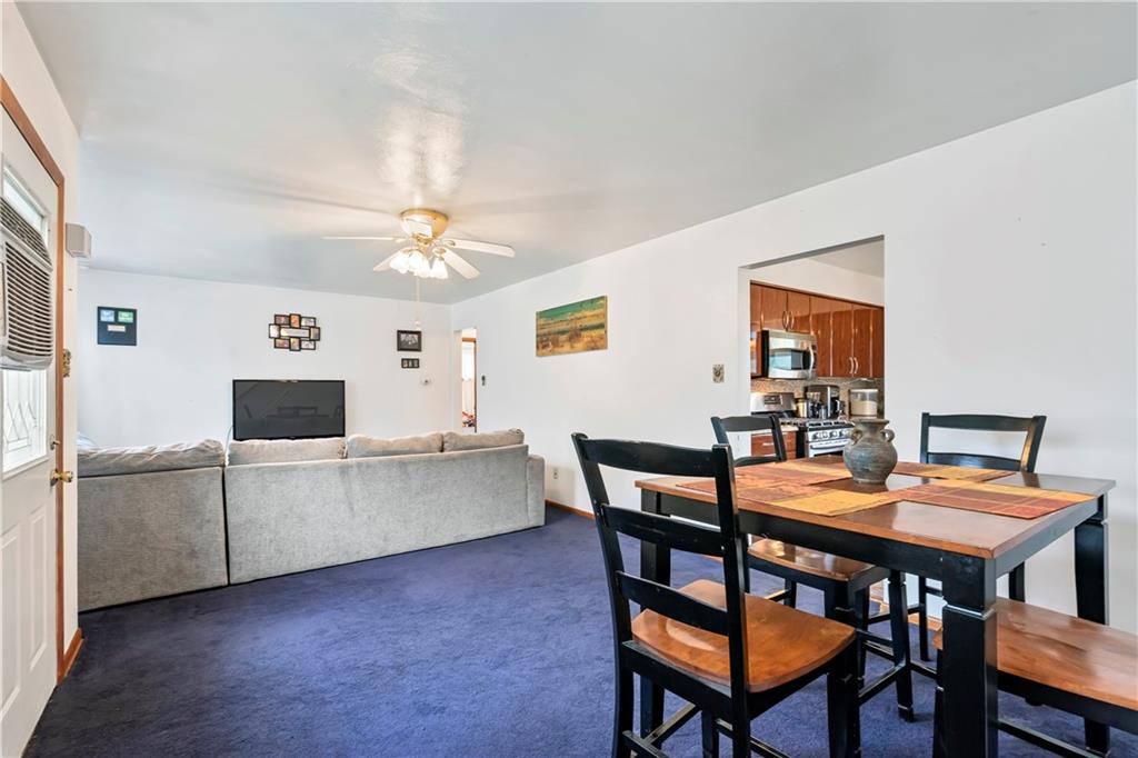 1820 Conway Wallrose Road Freedom, PA 15042 - Photo 3 of 25 a view of a dining room with furniture and a chandelier fan