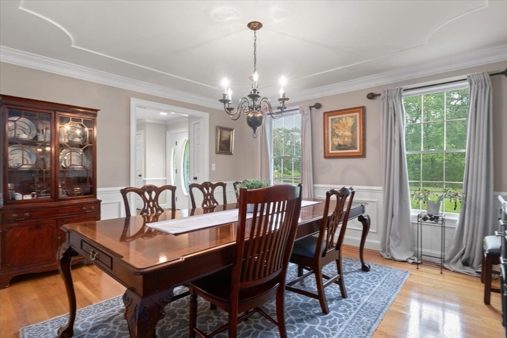 22 Dover Drive Walpole, MA 02081 - Photo 11 of 41 a view of a dining room with furniture window and wooden floor