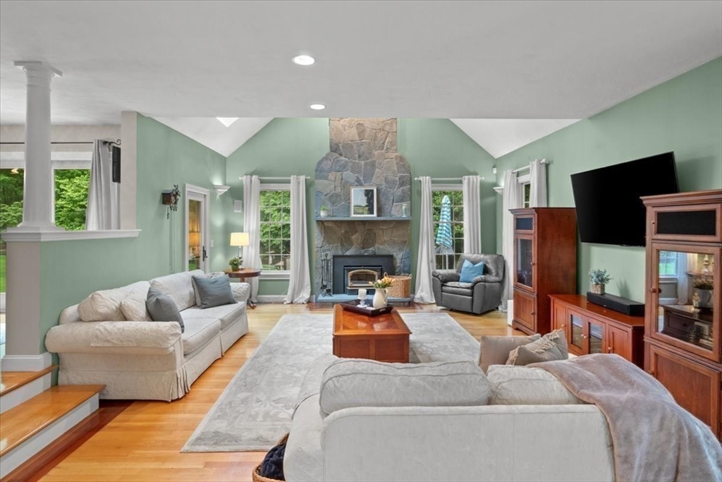 22 Dover Drive Walpole, MA 02081 - Photo 13 of 41 a living room with furniture flat screen tv and a fireplace
