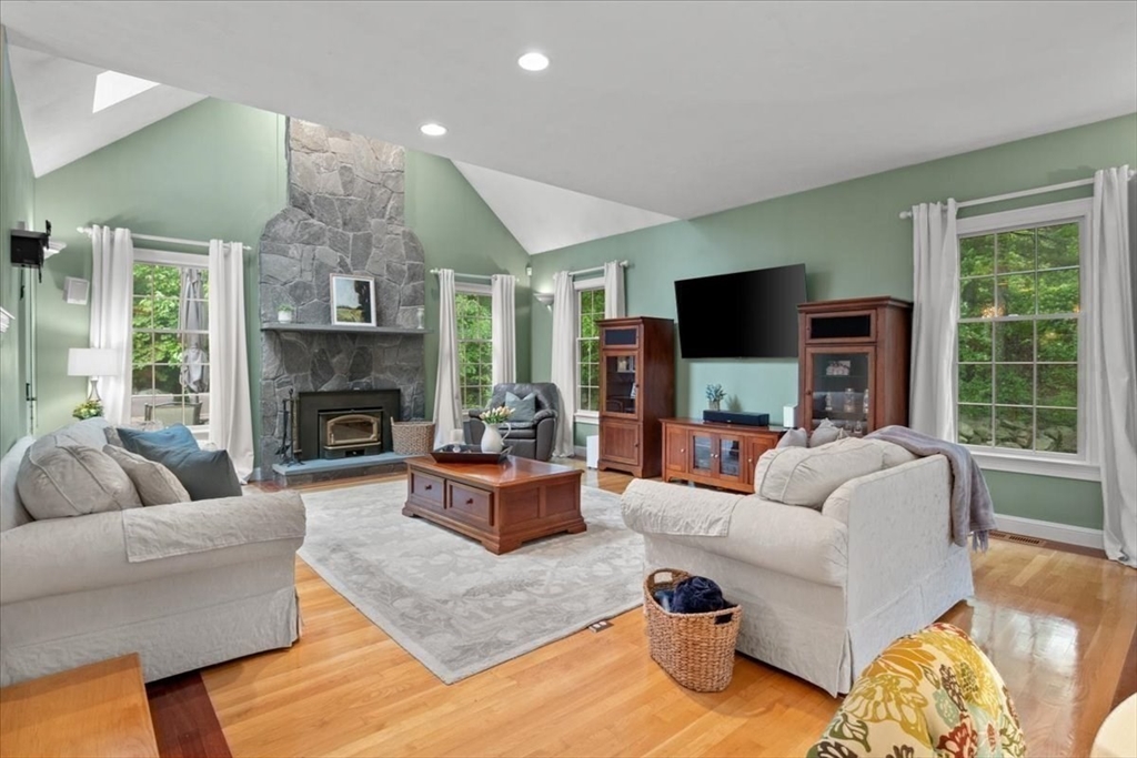 22 Dover Drive Walpole, MA 02081 - Photo 14 of 41 a living room with furniture flat screen tv and a fireplace