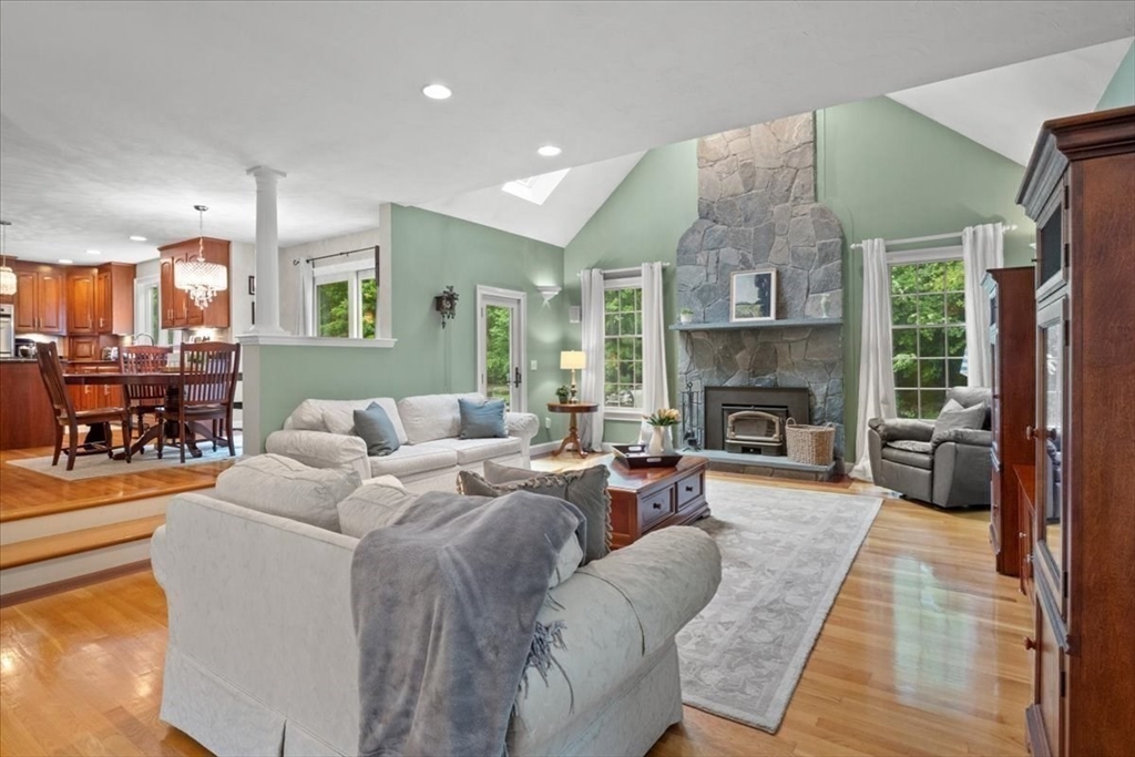 22 Dover Drive Walpole, MA 02081 - Photo 15 of 41 a living room with furniture fireplace and a large window