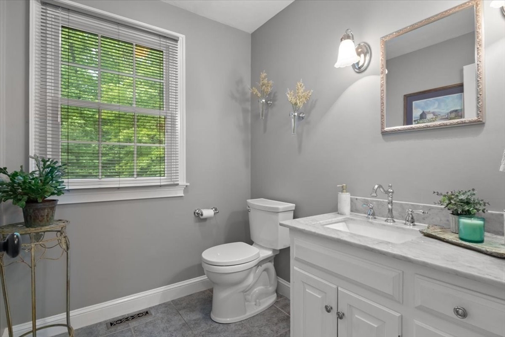 22 Dover Drive Walpole, MA 02081 - Photo 20 of 41 a bathroom with a sink a toilet and a window