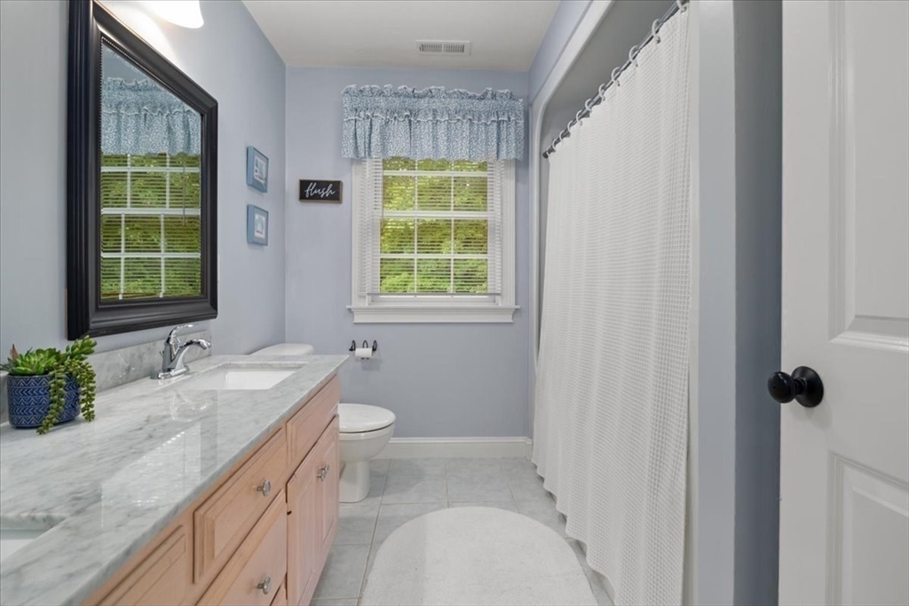 22 Dover Drive Walpole, MA 02081 - Photo 28 of 41 a bathroom with a granite countertop sink toilet and shower
