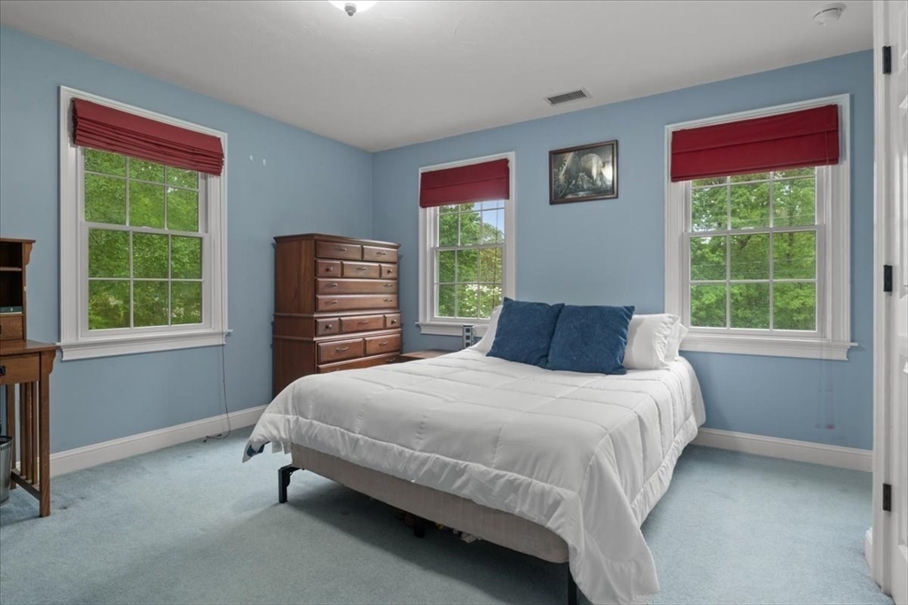 22 Dover Drive Walpole, MA 02081 - Photo 30 of 41 a bedroom with a bed and a window