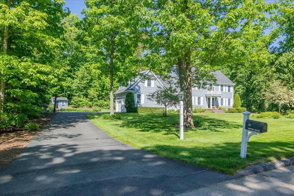 22 Dover Drive Walpole, MA 02081 - Photo 3 of 41 a porch with a tree in the grass