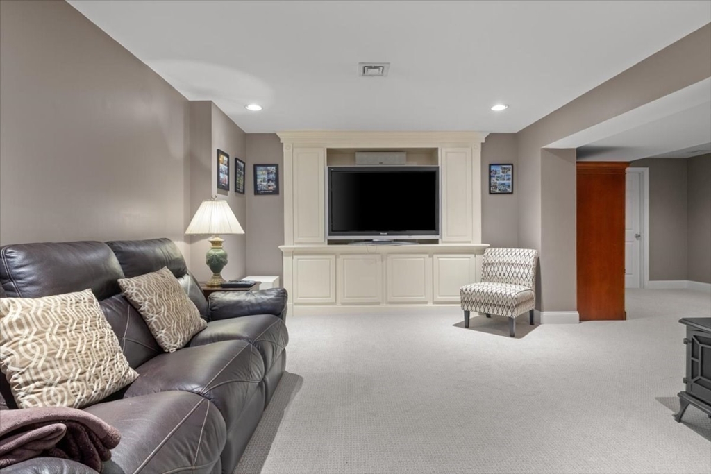 22 Dover Drive Walpole, MA 02081 - Photo 34 of 41 a living room with furniture and a flat screen tv