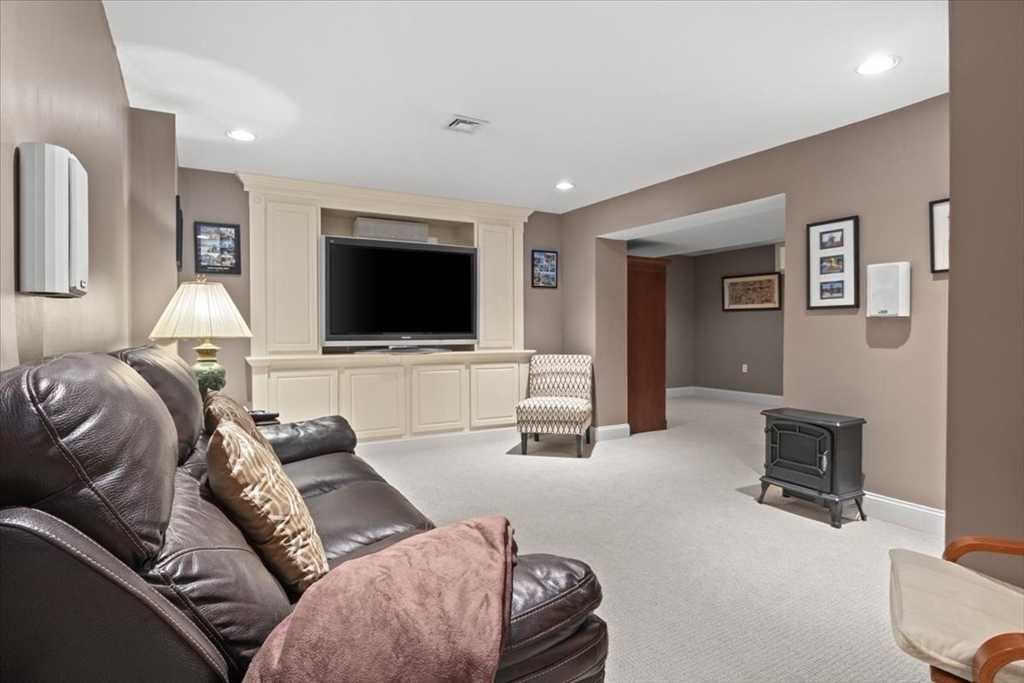 22 Dover Drive Walpole, MA 02081 - Photo 35 of 41 a living room with furniture and a flat screen tv