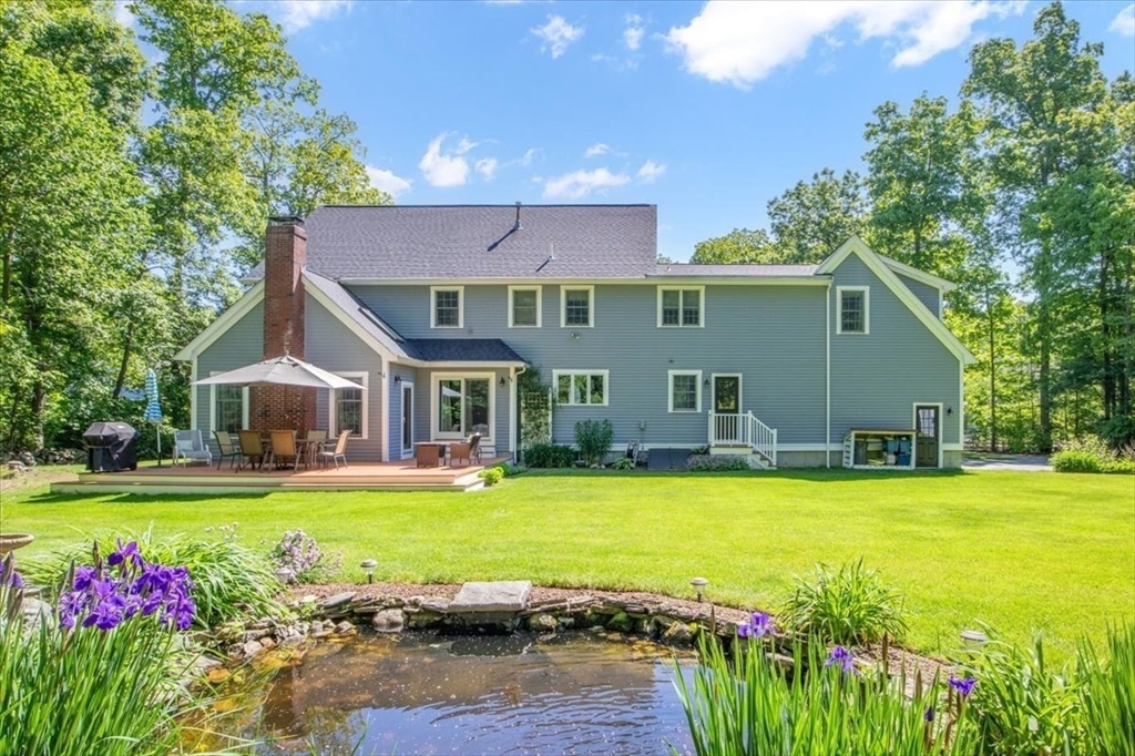 22 Dover Drive Walpole, MA 02081 - Photo 40 of 41 a view of a house with swimming pool and a yard