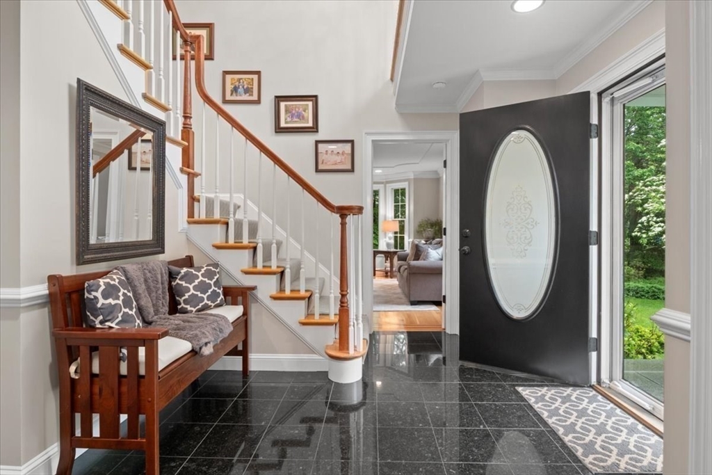 22 Dover Drive Walpole, MA 02081 - Photo 5 of 41 a living room with furniture and a mirror