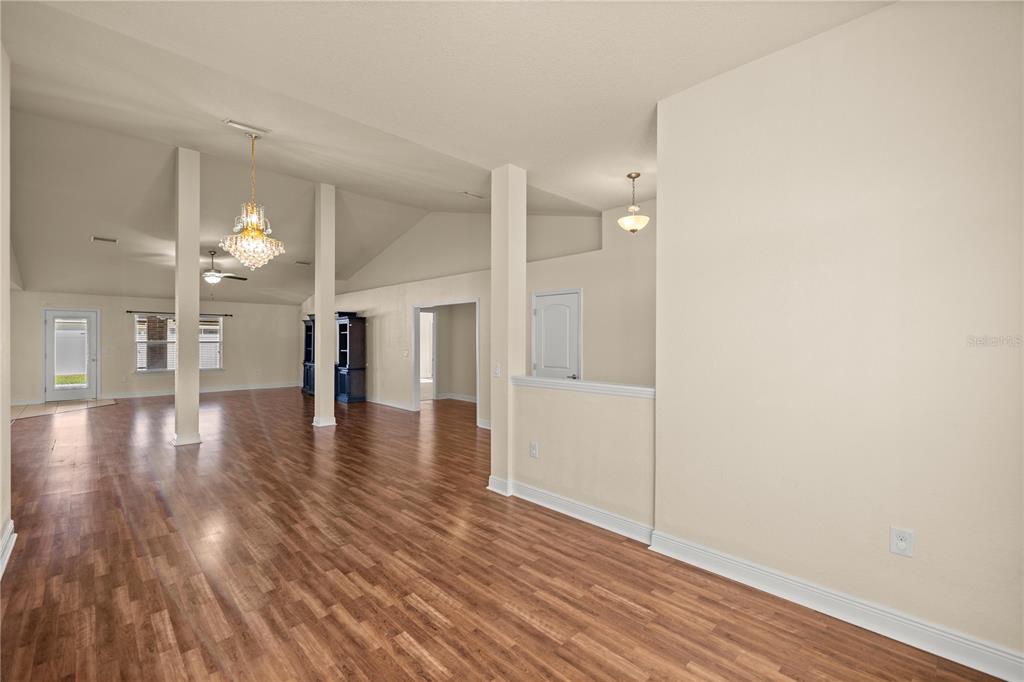 4441 Southwest 62nd Loop Ocala, FL 34474 - Photo 16 of 42 a view of a hallway with wooden floor