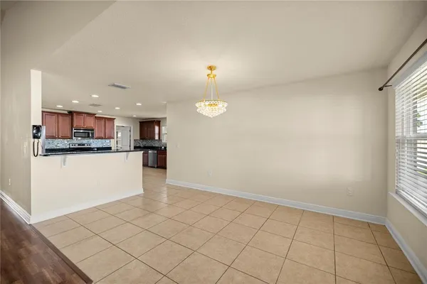 a view of kitchen with furniture and window
