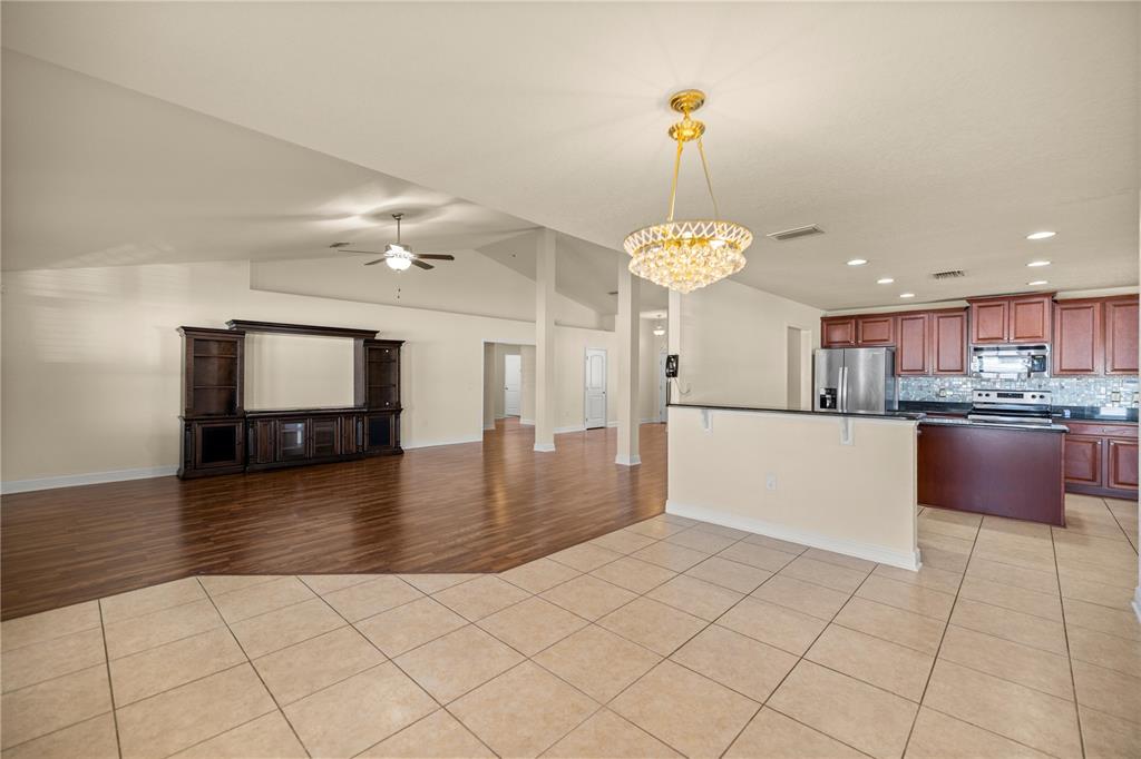 4441 Southwest 62nd Loop Ocala, FL 34474 - Photo 21 of 42 a view of a kitchen with a sink stainless steel appliances and cabinets
