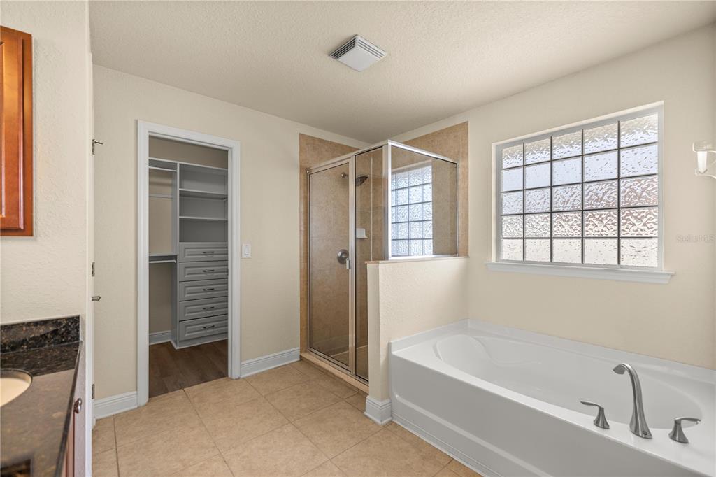 4441 Southwest 62nd Loop Ocala, FL 34474 - Photo 32 of 42 a bathroom with a bathtub and a shower