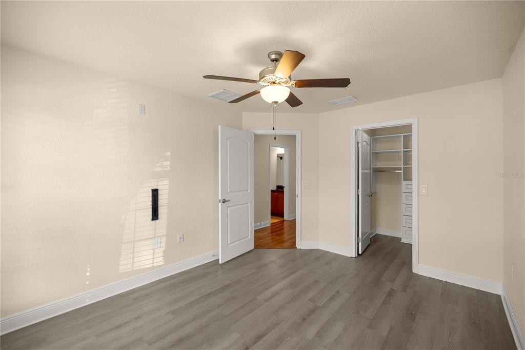 4441 Southwest 62nd Loop Ocala, FL 34474 - Photo 39 of 42 a view of an empty room with wooden floor