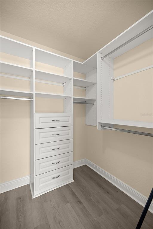 4441 Southwest 62nd Loop Ocala, FL 34474 - Photo 40 of 42 a view of walk in closet with empty racks