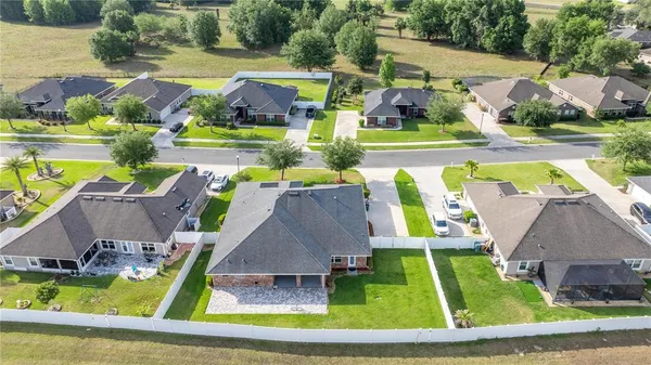 an aerial view of a house with a swimming pool