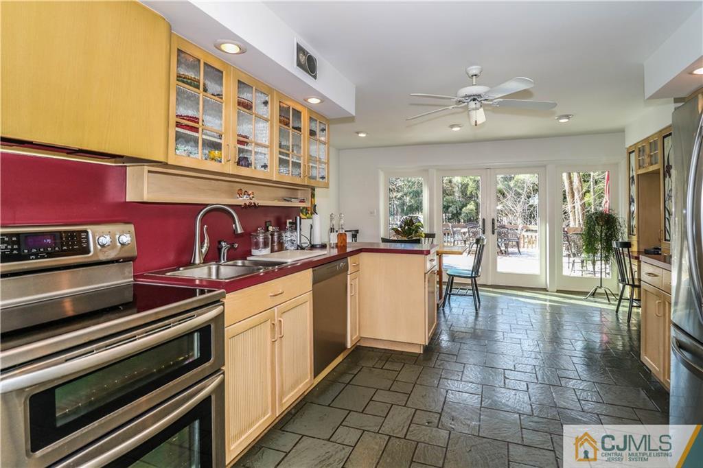 3 Whitewood Road Edison, NJ 08820 - Photo 8 of 28 a kitchen with stove and cabinets