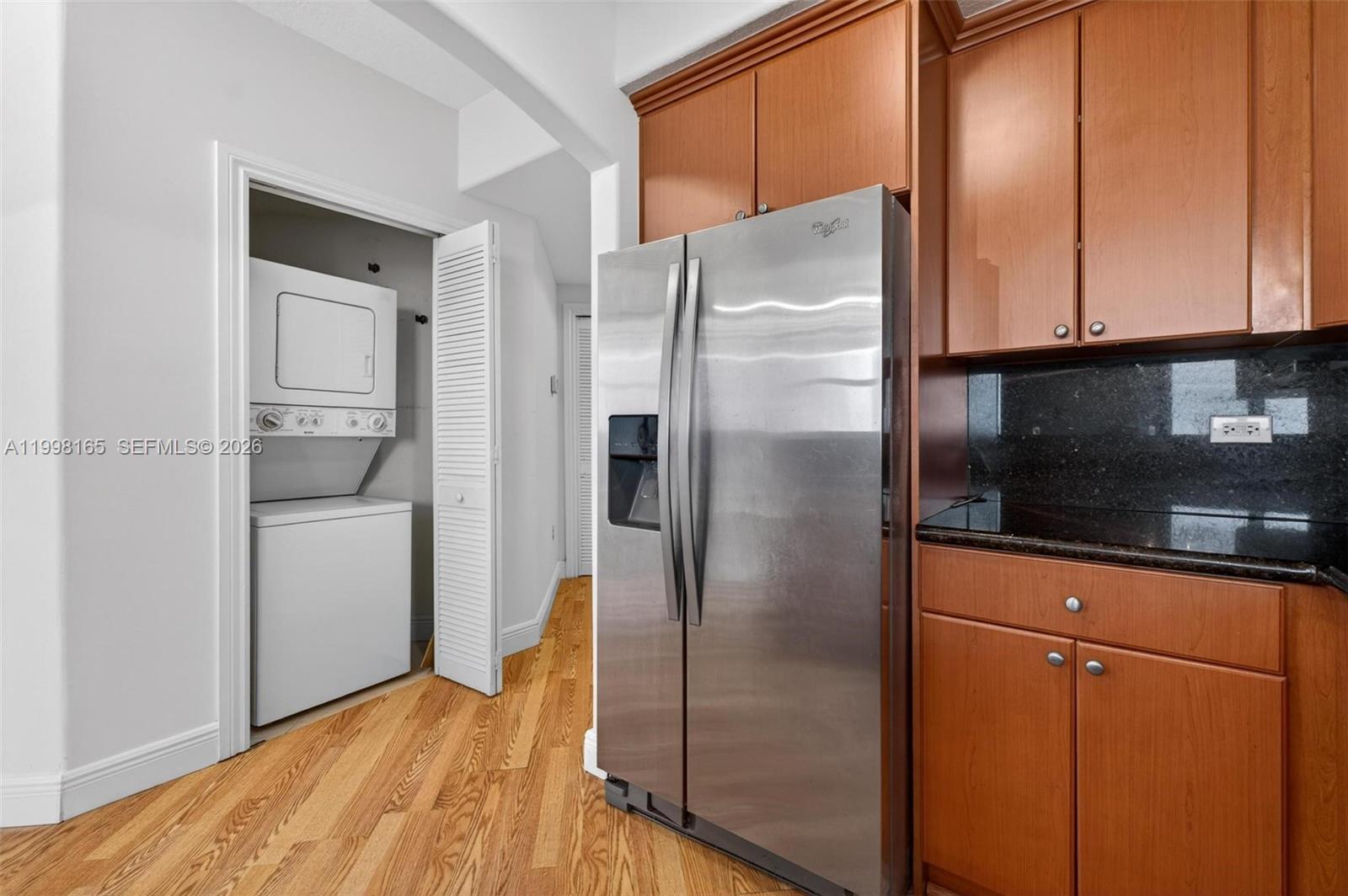 2301 Southwest 27th Avenue, Unit 906 Miami, FL 33145 - Photo 12 of 38 a kitchen with metallic refrigerator freezer and a dishwasher
